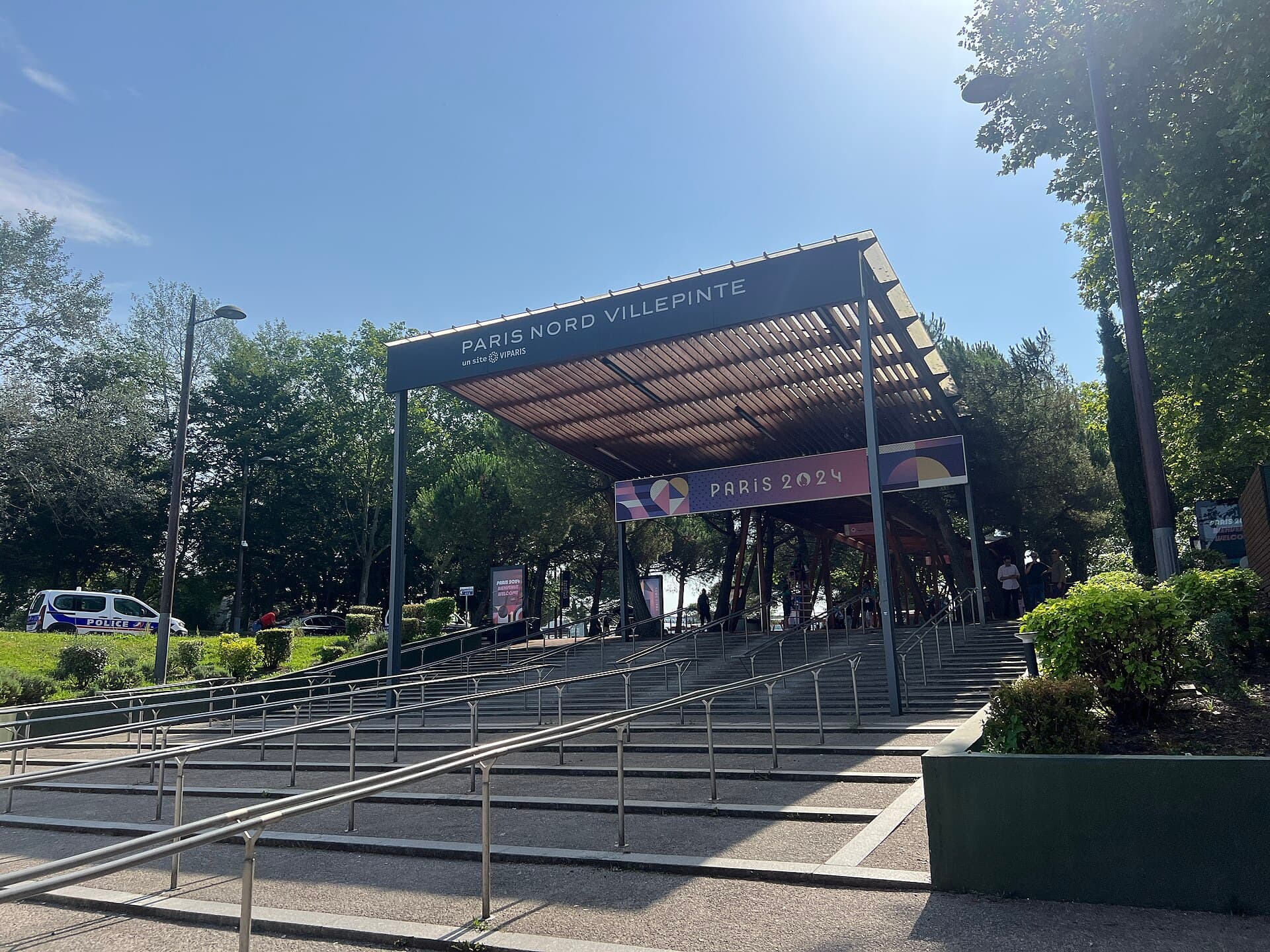 An entrance to the Paris Nord Villepinte exhibition centre in August 2024, with Paris 2024 Olympic signage.